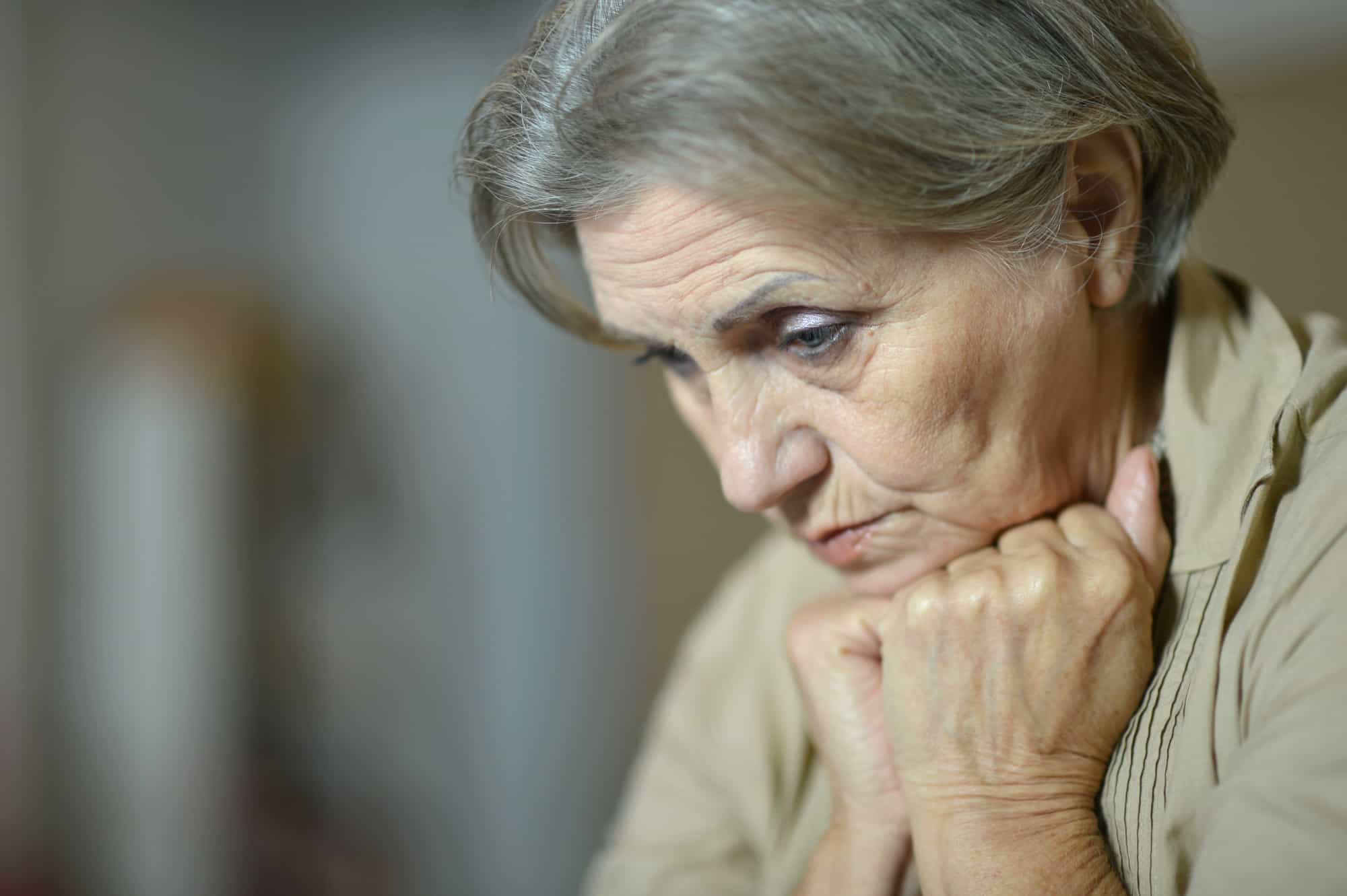 Old sad woman, nursing home neglect