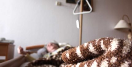 nursing home patient in bed