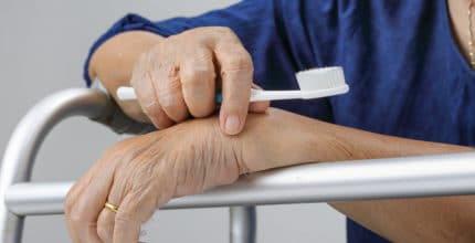 Asian elderly woman with a toothbrush. Dental health