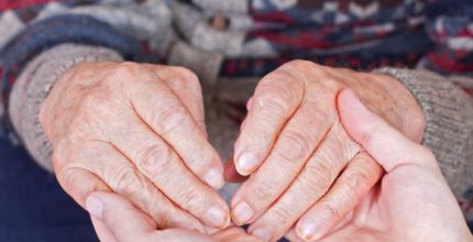 Old person holding hands