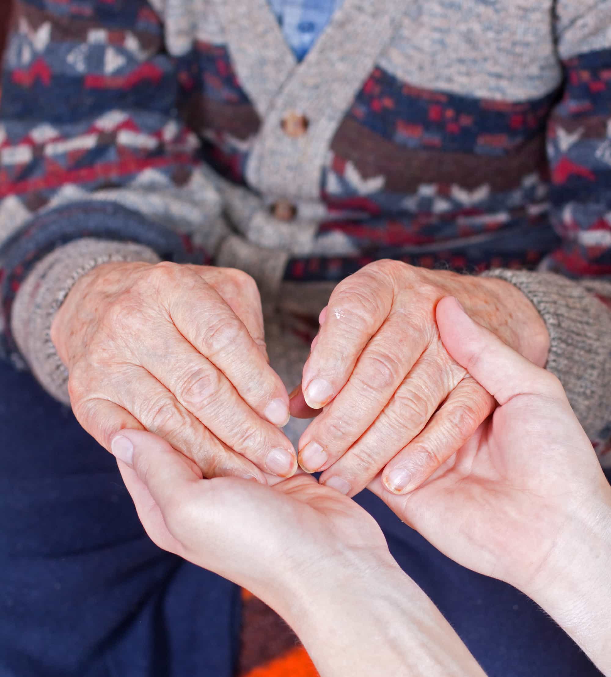 Old person holding hands