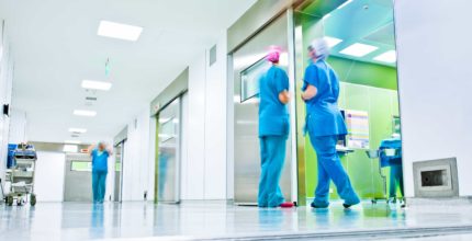 Blurred figures in medical uniforms